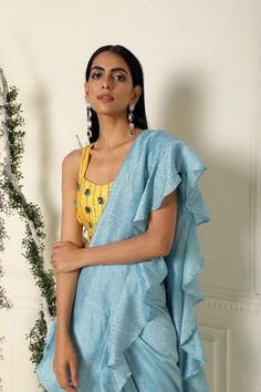 Ash Blue Ruffle Saree with Stitched Blouse Set of 2 - Trendroots Festive Blouse Piece With Ruffles And Traditional Drape, Designer Blouse Piece With Ruffles For Festivals, Traditional Pre-draped Saree With Ruffles For Summer, Bollywood Style Blouse With Traditional Drape And Ruffles, Traditional Pre-draped Saree With Ruffles For Navratri, Traditional Blouse Piece With Ruffles For Navratri, Festive Traditional Blouse Piece With Ruffles, Ruffled Pre-draped Saree For Festivals, Anarkali Pre-draped Saree With Ruffles