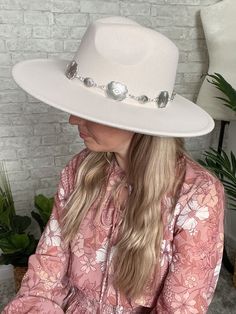 This is the perfect crisp flat brim hat for those who have a smaller sized head and no hat seems to fit them! It has a drawstring on the inside if you need to adjust it and make it a little smaller. The fabric of the hat itself has a little bit of give to it! The width of the brim on the hat itself is 3.75" wide. The color is ivory with a decorative silver chain. The circumference of the inside of the hat is 23.25”. Fabric is 90% Polyester + 10% Alloy. Hand wash only. Flat Brim Hat, Brim Hat, Wide Brimmed, Cowboy Hats, Make It, Silver Chain, Hand Wash, Chain, Hats