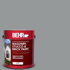 behr masonry stucco and brick paint in dark grey, with the words behr on it