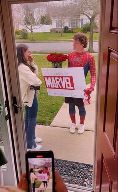 someone holding up a sign that says, i'm sorry to the spider - man