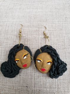 Clara features a side braided bun, is hand painted and hand, sculpted. Made to order 18k gold plated hooks Lightweight