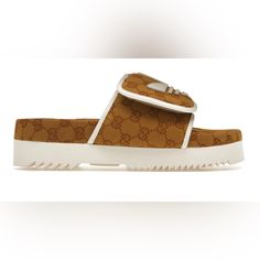 New Gucci Adidas Slides/Sandals Designer Brown Sandals With Buckle Closure, Designer Brown Flat Slides, Luxury Brown Slides, Luxury Brown Slides With Round Toe, Luxury Brown Sandals With Round Toe, Luxury Brown Slip-on Sandals, Designer Beige Slip-on Sandals, Designer Beige Sandals With Open Heel, Designer Beige Open Toe Sandals