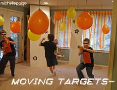 some kids are playing with orange and yellow balloons