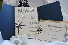 a blue and white wedding card with a star on the front is next to an envelope that says, all aboard