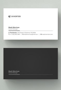 a black and white business card sitting on top of a table