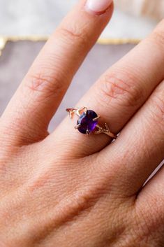 Our dainty Amethyst Ring is part of our new Birthstone Ring Collection! This beautiful, yet delicate ring is made with top-quality, genuine Amethyst. The February Birthstone represents beauty + courage. Not to mention, the unique look of the whimsical vine ring setting will ensure endless compliments. #amethystring #daintyrings #jewelry #rings #amethyst #februarybirthstone #birthstonejewelry #birthstones #wanderandlustjewelry Rings Amethyst, Dainty Gold Ring, Vine Ring, February Birthday Gifts, Dainty Rings, February Birthday, Dainty Gold Rings, Ring Collection, Oval Ring