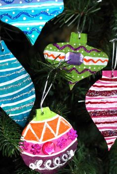 colorful ornaments hanging from a christmas tree