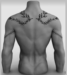 the back of a man's body with tattoos on his upper and lower half