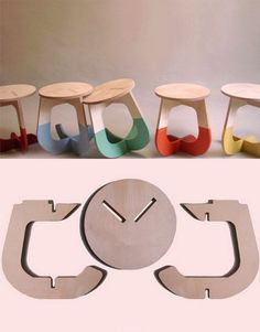 a clock made out of wooden pieces with different colors and shapes on the face, sitting in front of a group of stools