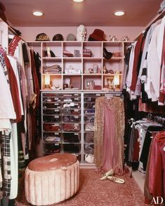 the closet is full of clothes, shoes and other things to wear in this room