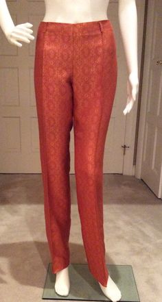 These brocade trousers are meant to be layered under romantic Gigli jackets and renaissance influenced silk vests with a neckline covered in a satin top’s collar. Mix colors,textures, and layers to get the authentic luxury style of Gigli. These trousers are unhemmed so you can do a tall pant cuff, shorten to Capri length, or a plain hem. The waistline sits slightly below the natural waist. There are five 1 1/2” self belt loops. The workmanship is typical of Romeo Gigli. The back of the trousers Elegant Silk Bottoms For Festive Season, Festive Silk Evening Bottoms, Elegant Festive Pants, Gold Formal Bottoms, Elegant Silk Wedding Pants, Elegant Fitted Pants For Festive Occasions, Elegant Gold Bottoms For Festive Occasions, Elegant Festive Gold Bottoms, Elegant Gold Wedding Bottoms