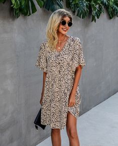 The EMES SHOP dress is detailed with a bold contrast button design. Features a v neck line. animal prints. short ruffle sleeves. flowy skirt. and above knee length. Pair it with sunnies and sandals for a chic summer look.MATERIAL:100% Soft Poly MEASUREMENTS:Dress Length is 36"-39"in Small | Bust& Waist: 36"-38"in Medium | Bust& Waist: 38"-40"in Large | Bust& Waist: 40"-42"in X Large | Bust& Waist: 42"-44"in Chic Leopard Print Mini Dress For Beach, Leopard Print V-neck Beach Dress, Chic Leopard Print V-neck Mini Dress, Leopard Print V-neck Mini Dress For Day Out, V-neck Leopard Print Mini Dress For Day Out, Casual Leopard Print Mini Dress For Beach, Leopard Print Mini Dress For Vacation, Leopard Print Mini Dress For Beach, Leopard Print Mini Beach Dress