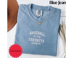 This is a Comfort Colors garment-dyed embroidered baseball is my favorite season shirt; a comfort colors tee made 100% with ring-spun cotton. The soft-washed, garment-dyed fabric brings extra coziness to your wardrobe while the relaxed fit makes it an excellent daily choice. The double-needle stitching throughout the embroidered baseball mom tee makes it highly durable while the lack of side-seams helps this baseball pocket shirt shirt retain its tubular shape. .: 100% ring-spun cotton .: Medium Baseball Fan Shirts, Baseball Fashion, Baseball Mom Shirt, Baseball Mom Shirts, Baseball Gifts, Embroidered Baseball, Embroidered Tee, Baseball Fan, Sports Mom