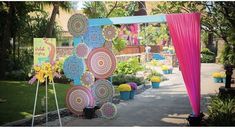 an outdoor area with flowers and umbrellas