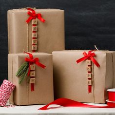 three wrapped presents sitting on top of a table