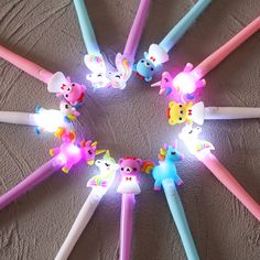 several different colored toothbrushes arranged in a circle