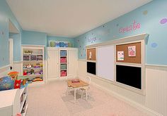 a child's playroom with blue walls and pink carpeted flooring is shown