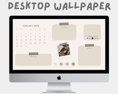 a desktop computer monitor sitting on top of a desk with the word desktop wallpaper above it