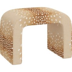 an animal print stool with white spots on it