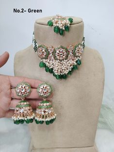 *Light Weight kundan choker set with earrings. *Necklace width- 2.6  inches(included drops) *Earrings Length- 2.7 inches *Earrings dome width- 1.2 inches Festive Green Meenakari Choker, Green Meenakari Temple Jewelry Choker, Green Kundan Choker Necklace With Cutdana, Green Kundan Bollywood Choker, Green Kundan Choker Necklace For Diwali, Festive Green Kundan Choker, Green Bollywood Choker With Cutdana, Green Chandbali Choker For Diwali, Green Meenakari Choker Bridal Necklace