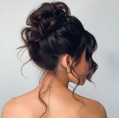 2. Effortless High Bun. High buns provide a great jumping-off point for wedding updos for medium hair, and you can get your version as soft and relaxed as this style. Prom Hairstyles Up Bun, High Fancy Bun, High Prom Bun, High Messy Bun Updo Wedding, Prom Updos Bun, Messy Bun Updo Prom, High Prom Updos, High Up Do Hairstyles, 90s High Bun Wedding