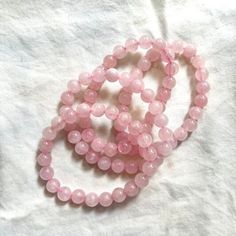 Elevate your style and well-being with our Pink Rose Quartz Bracelet. This exquisite bracelet features genuine rose quartz beads, renowned for their ability to attract love, promote emotional healing, and create a sense of calm. The soft pink hues of the rose quartz beads add a touch of elegance to any outfit, making it suitable for both everyday wear and special occasions. Our skilled artisans handcraft each bracelet with attention to detail, ensuring that you receive a unique piece that carrie Rose Quartz Round Crystal Bracelet For Meditation, Rose Quartz Crystal Bracelet For Meditation, Round Rose Quartz Crystal Bracelet For Relaxation, Elegant Rose Quartz Crystal Bracelet For Meditation, Spiritual Rose Quartz Bracelet With Gemstone Beads, Pink Rose Quartz Bracelets For Meditation, Pink Rose Quartz Bracelet For Meditation, Meditation Rose Quartz Crystal Bracelet With Natural Stones, Rose Quartz Gemstone Beads Bracelet For Meditation