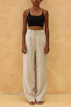 The tie front wide leg pants offer a relaxed fit with an adjustable waist for effortless style. Handcrafted in our studio to your measurements and preferences, available in over 60 colors. DETAILS - 100 % linen, medium weight (200gsm), free-shrinkage, amazingly soft feel - Floor length pants; different length is possible - High waisted - Wide-legs - Front zipper with detachable ties - Inseam pockets - Custom made pants, FREE customizations; simply let us know your needs (hem length, fit style, leg opening width, belt, etc.). - Handcrafted in our studio, French seams, clean and meticulous COLOR - The color shown is Cream. - Available in over 60 colors, choose color in the color chart in the listing. - Link of fabric samples available here: https://madebygaiavn.etsy.com/listing/1399149538 - Wide Leg Linen Pants With Tie Waist, Beige Wide Leg Pants With Tie Waist, Relaxed Fit Linen Bottoms With Tie Waist, Baggy High Waist Linen Wide Leg Pants, Linen Bottoms With Tie Waist And Relaxed Fit, Linen Bottoms With Tie Waist And Loose Fit, Linen Bottoms With Tie Waist, Linen Straight Pants With Tie Waist, Linen Trousers With Tie Waist