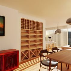 a dining room table with chairs and bookshelves