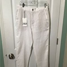 Zara Beautiful White Linen Pants .Has Drawstring Around Waist.Size Medium.Brand New With Tag Side Pockets.Has Tan Interfacing Back In Front. See All Pics 100% Linen. Zara Luxury Straight Leg Pants, Luxury Beige Zara Pants, Zara Straight Leg Linen Pants, Relaxed White Linen Bottoms, Zara Cream Cotton Pants, Luxury Zara Ankle-length Pants, Cream High-waisted Linen Pants, White Linen Wide-leg Bottoms, Zara Jumpsuit