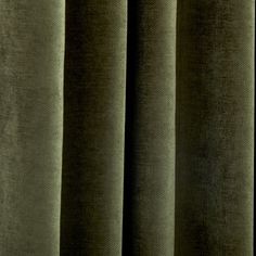 a close up view of a curtain with dark green fabric on the bottom and side