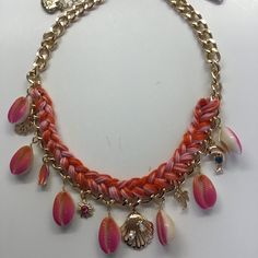 17" Heavy Gold Chain With Middle 7-1/2" Having Orange And Yellow Crochet On Chain, Suspending 7 Orange Shells With Cream Undersides Alternating With Charms. Chain And Charms Have 1-1/2" Width. Charms Include Gold Palm Frond, Hot Pink And Orange Surf Board, Orange Rhinestone In Gold Star, Gold Sea Shell With Pearl And Rhinestone, Gold Palm Tree, And Gold Dolphin Jumping Over Blue Rhinestone. Lobster Claw Closure, 3" Extender, And Betsey Heart. Gold Findings. Retail - $78. Nwt Pink Chain Jewelry For Summer, Summer Pink Chain Jewelry, Handmade Yellow Necklaces For Vacation, Handmade Yellow Necklace For Vacation, Yellow Bohemian Necklaces For Vacation, Multicolor Necklace With Lobster Clasp, Adjustable Yellow Necklace For Beach, Adjustable Yellow Necklace For The Beach, Yellow Necklaces For Beach Occasion