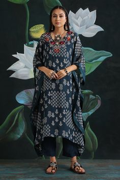 Blue kaftan tunic with all-over print and embroidered V-neckline. Comes with straight fit pant.
Component: 2
Printed, Embroidered
Neckline: V-Neck
Sleeve Length: Three Quarter
Fabric: Flat Chiffon, Cotton Silk
Color: Blue
Asymmetric hem
Straight fit pant - Aza Fashions Bohemian Printed Tunic For Eid, Bohemian Floral Print Tunic For Eid, Blue Printed Anarkali Kurta, Bohemian Straight Kurta Tunic For Navratri, Blue Anarkali Kurta With Printed Details, Printed Tunic For Eid, Traditional Navratri Tunic With Printed Motifs, Bohemian Tunic With Printed Motifs For Festive Occasions, Bohemian Eid Tunic With Printed Motifs