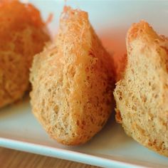 three pieces of bread sitting on top of a white plate