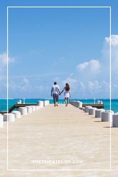 two people walking on a pier with the ocean in the background and text overlay that reads, there is no image here