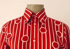 "True vintage top, featuring all over bold red and white geometric pattern, topped with a stately winged collar and classic button up placket. Designer label removed. Approximate Measurements: Shoulder: 14\"; Chest: 35\"; Length: 24.5\"; Labeled a Size 8 Fabric: 100% polyester Eye catching retro blouse, circa 1960s, is in excellent vintage condition. Enjoy! *(International Buyers are welcome - however, please email me so I can check the shipping rate for you before committing to buy.) bt"