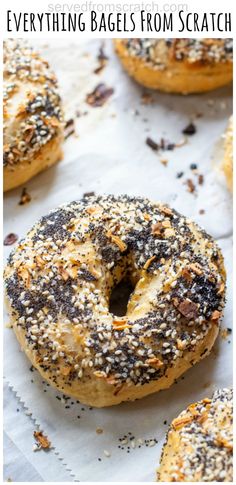 bagels with sesame seeds on them and the words everything bagels from scratch