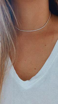 Cubic Zirconia Tennis Necklace | 14K Gold Filled | 2.2 MM Diamond Tennis Choker Necklace | Bridal Jewelry | Dainty Minimalist Necklace ------------------------------------------------- ♦ --------------------------------------------------- Beautiful Tennis choker necklace. It compliments any outfit. A wonderful gift for yourself or for any loved one and friend - purchase one today!♦ Materials: 18K Gold Filled ♦ Available colors: Gold ♦ Necklace measurements: the total length is 15.5" and the ston Dainty Diamond White Necklace With Sparkling Stones, Dainty White Necklace With Sparkling Stones, Round Tennis Necklace With Clavicle Chain For Wedding, Minimalist Cubic Zirconia Tennis Necklace, Dainty Crystal Diamond Necklace With Accents, Minimalist Diamond Tennis Necklace, Elegant White Tennis Necklace With Clavicle Chain, Dainty Jewelry With Sparkling Round Cut Stones, Dainty Diamond White Crystal Necklace