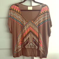 This Top Was Purchased At A Cute Boutique In Jackson Hole, Wyoming. It Was Never Worn And Is In Perfect Condition. It Is Crop In The Front And Low In The Back. Bohemian Brown Top With Graphic Print, Brown Graphic Print Top For Festival, One Size Brown Tops For Beach, Trendy Brown Tops For Festival, Trendy Brown Festival Tops, Trendy Brown Top For Festival, One Size Bohemian Printed Tops, Bohemian Printed One Size Tops, One Size Multicolor Printed Tops