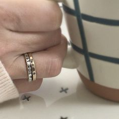 Add a touch of individuality to your jewelry collection with the Typewriter Name Ring from Going Golden. Handcrafted in Brownsburg, Indiana, this ring is perfect for those who love a classic, typewriter-style font. Available in 14K gold-filled, fine silver, or rose gold, this ring offers 100x more solid gold than plated alternatives, ensuring it’s waterproof and tarnish-resistant. Each ring comes with a polishing pad and a gift box, making it a thoughtful gift for someone special or a delightful Heirloom Rose Gold Stackable Rings Stamped 14k, Tarnish Resistant Brass Rings For Anniversary, Gold Sterling Silver Stackable Engraved Ring, Gold Sterling Silver Ring With Hallmarks, Gold Sterling Silver Engraved Ring For Promise, Classic Gold Stackable Rings As Gift, Adjustable Gold Sterling Silver Engraved Ring, Heirloom Style Gold Stackable Sterling Silver Rings, Heirloom Gold-toned Sterling Silver Stackable Rings