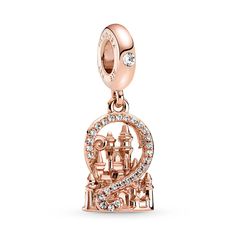 Wear your excitement for a Disney Parks visit with this enchanting Dangle Charm from Pandora. Hand-finished in 14k rose gold plating, this warm-toned keepsake features a 3D Fantasyland Castle framed by a swirl of sparkling clear cubic zirconia pavé. This charming souvenir is inspired by the iconic castles at Disney Parks, so that true fans can carry the magic with them everywhere they go. Gift For Disney Princess, Cheap Disney Jewelry For Women, Cheap Women's Disney Jewelry, Disney Parks Pandora Charms, Disney Castle Earrings, Disney Easter, Pandora Rose, Pandora Disney, Pandora Bracelet Charms