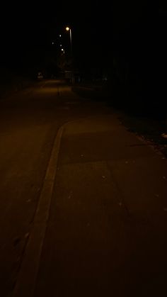 an empty street at night with no one on it