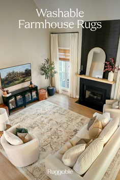 a living room filled with furniture and a fire place in front of a tv mounted on a wall