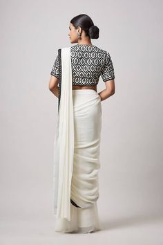 Ivory pre-draped saree featuring contrast black hem. Paired with a floral hand embroidered blouse. - Aza Fashions Dhoti Saree, Cotton Sarees Handloom, Hand Embroidered Blouse, Draped Saree, Embroidered Hem, Drape Saree, Lehenga Saree, Blouse For Women, Fashion App