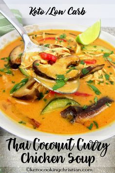 thai coconut curry chicken soup in a white bowl with a spoon and lime on top