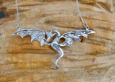 Our dragons come from fire! The dragon was carefully handcrafted from copper and plated with silver. He will adorn and protect you and attract attention. The necklace is absolutely unique, which impresses with unique details! More for jewellery enthusiasts can be found here: https://www.etsy.com/de/shop/Loewenherzschmuck ➽ The handmade: All our necklaces are made by our blacksmith in a small studio in France. It is 100% handmade, each one is unique! ➽ The materials: We use copper as the starting Wax Carving Jewelry, Carving Jewelry, Wax Carving, Murano Glass Beads, Unique Necklace, Small Studio, Special Friend, Unique Necklaces, The Dragon