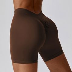 87% Nylon. 13% Spandex Soft. comfortable. skin friendly 4-way stretch. breathable and sweat-wicking Squat-proof Seamless fabric Back piece waist head V waist design Hip pumping pleat design. highlighting the peach buttocks Perfect for both sports activities and daily life Brown Athleisure Activewear With Built-in Shorts, Gym Bottoms With Built-in Shorts In Brown, Brown Gym Bottoms With Built-in Shorts, Fitted Seamless Brown Bottoms, Brown Stretch Athleisure Bottoms, Brown Seamless Stretch Activewear, Sporty Stretch Brown Shorts, Elastic Gym Bottoms, Elastic Fit Solid Color Gym Bottoms