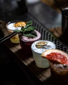 three different kinds of drinks on a table