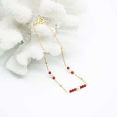 Handmade red coral and seed pearls bracelet in gold filled with a delicate design. We have a passion for ocean gemstones because water is the origin of life. A designer touch as an everyday elevation. It will add an elegant and delightful touch to any look. ⚜ Specs❀ Gold Filled Chain and Extenstion; Gold Plated Clasp❀ Red Coral Dyed from Natural White Coral❀ 6 Seed Pearls❀ Length: 18 - 21cm (7-8 Inch) Adjustable Elegant Coral Bracelet For Gift, Elegant Red Coral Beaded Bracelets With Adjustable Fit, Elegant Red Coral Beaded Bracelets For Gift, Elegant Red Coral Beaded Bracelet Gift, Elegant Gold Bracelets For Holidays, Elegant Gold Bracelets For Holiday, Gold Red Coral Bracelets As Gift, Gold Red Coral Bracelet As A Gift, Gold Bracelets With Red Coral As Gift