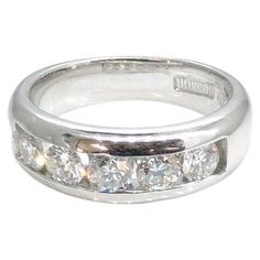 Hand made classy and solid 18 carat White gold ring (eternity ring) channel set with five round brilliant cut diamonds Total weight of diamonds is 1.00 carats clarity is VS, colour G-H Size L 1/2 (US size 6) Ring weight is 8.6 grams Ring is 6.5 mm wide at the front setting and 4.1 mm wide at the back Channel Set, White Gold Ring, Jewelry Rings Engagement, Round Brilliant Cut Diamond, Bridal Rings, Brilliant Cut Diamond, White Gold Rings, Eternity Ring, Luxury Jewelry