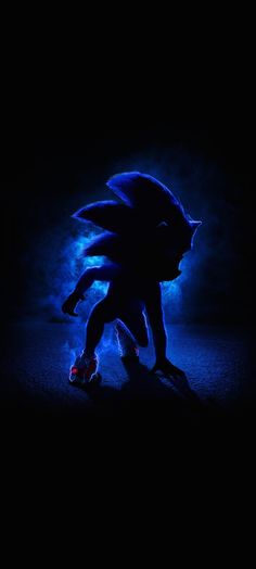 sonic the hedgehog is glowing in the dark with blue light coming from behind it